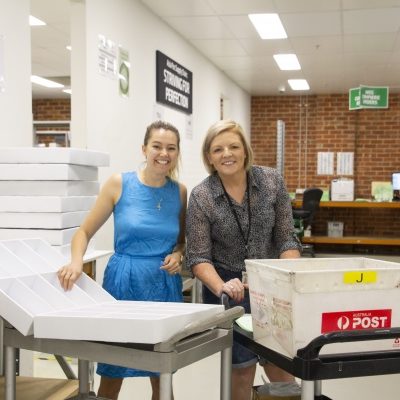 Specsavers employees helping in the lab.